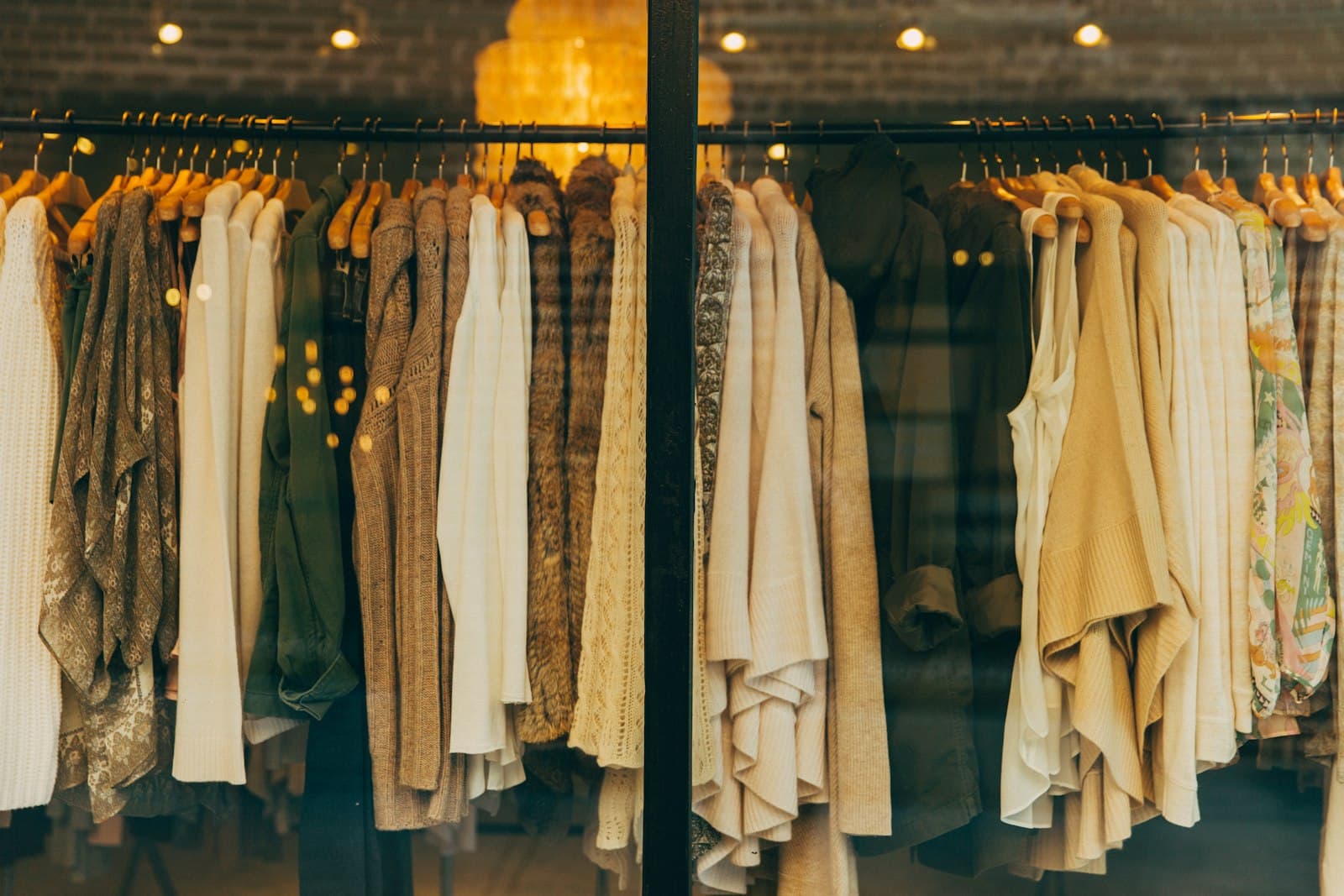 Cozy knitwear displayed in a warmly lit shop window