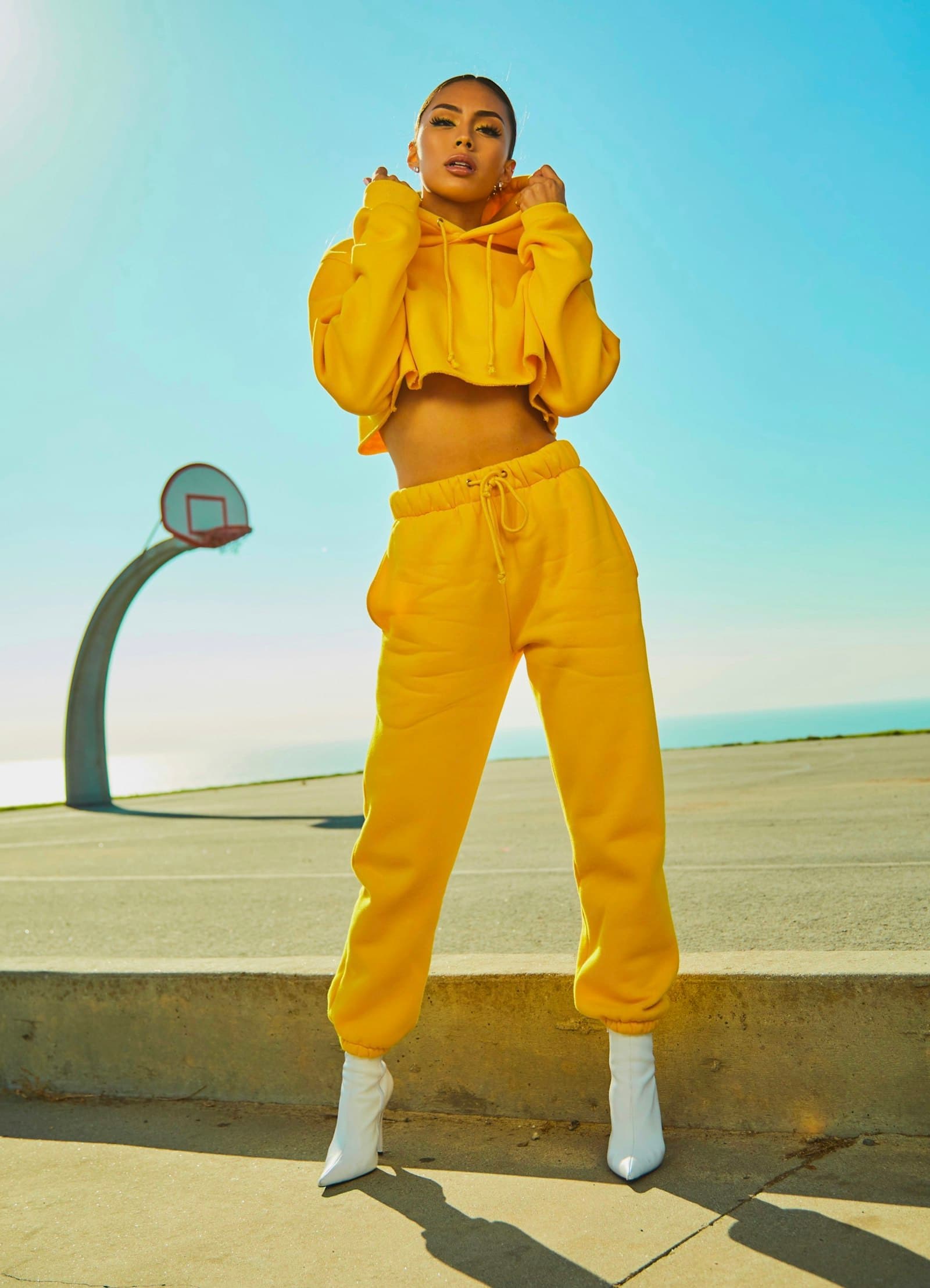 Woman in a marigold lounge set outdoors