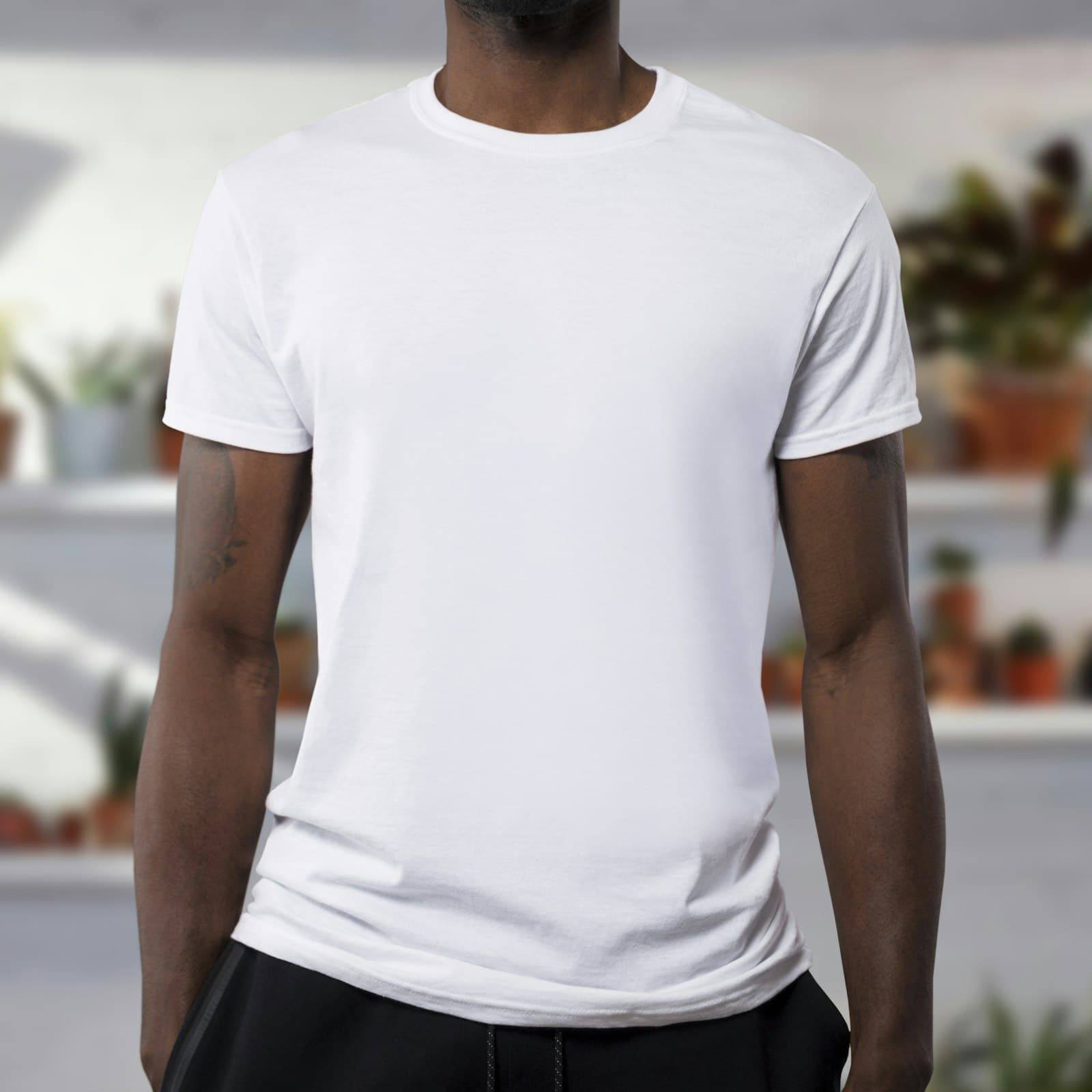 Model wearing a classic white relaxed-fit unisex tee